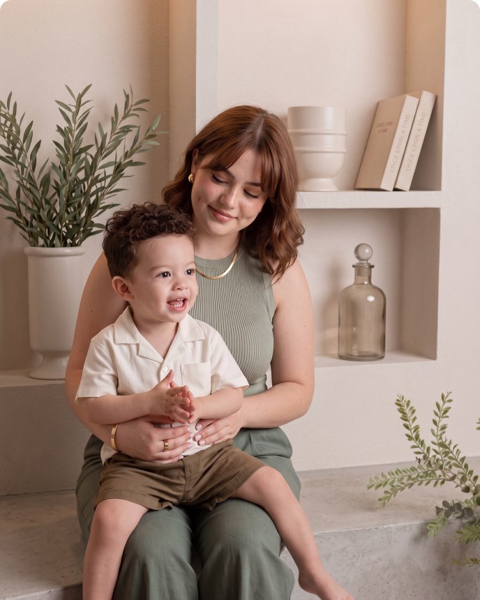 Parent holding their toddler during a studio mini session